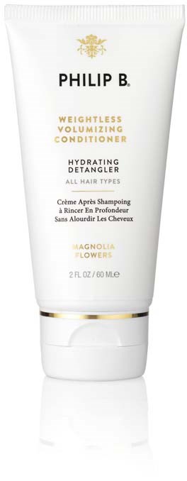 Eine weiße Tube von Philip B. Haarconditioner mit goldenen und schwarzen Details, für Feuchtigkeit und Entwirrung der Haare.