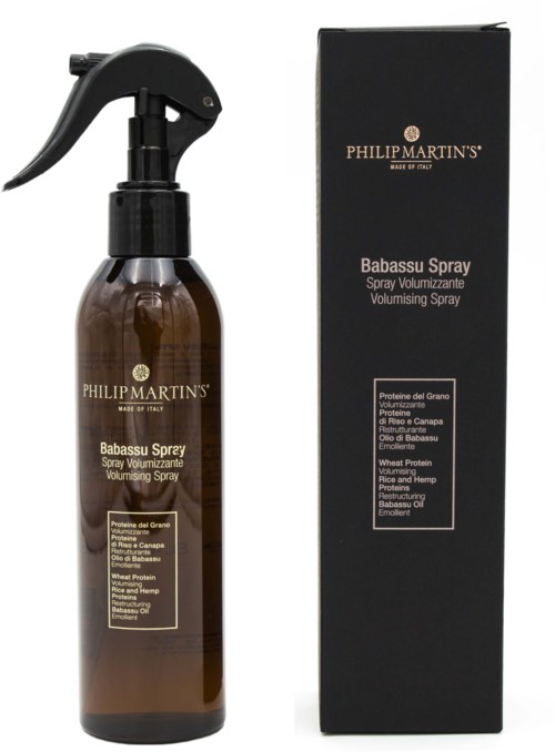 A brown spray bottle with a black spray head and a black box, both labeled Philp Martin's Babassu Spray for hair.