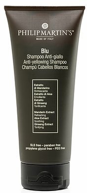 Black shampoo bottle with white text, labeled 'Philip Martin's Blu,' describing anti-yellowing benefits with natural extracts.