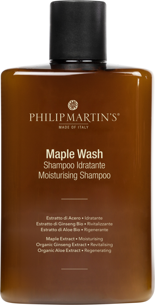 En brun flaske merket 'Maple Wash' sjampo med svart lokk, som beskrives som fuktighetsgivende og revitaliserende.