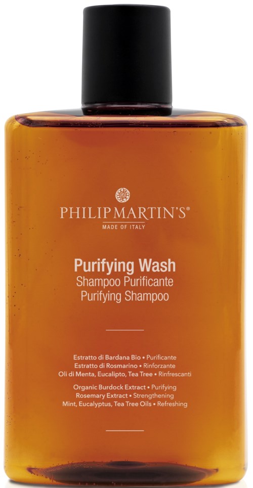 A brown bottle with a black cap labeled 'Purifying Wash' by Philip Martin's, containing shampoo ingredients.