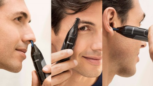 Men using small devices to clean or check ears, nose, and eyes. They have focused expressions and are close to their faces.