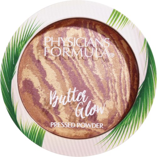 Ronde pressed powder met marmer beige en bruin kleurtje, omgeven door groene palmbladeren.