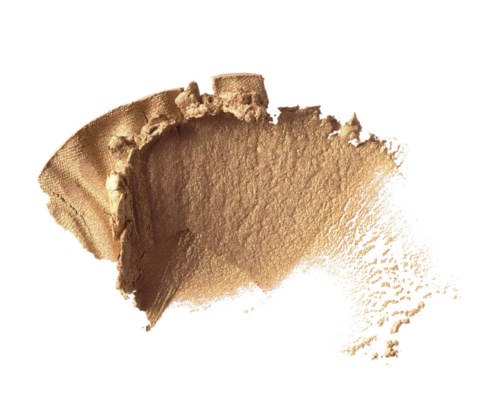 Een beige poeder met textuur en ongelijke randen, met een beetje verspreid.