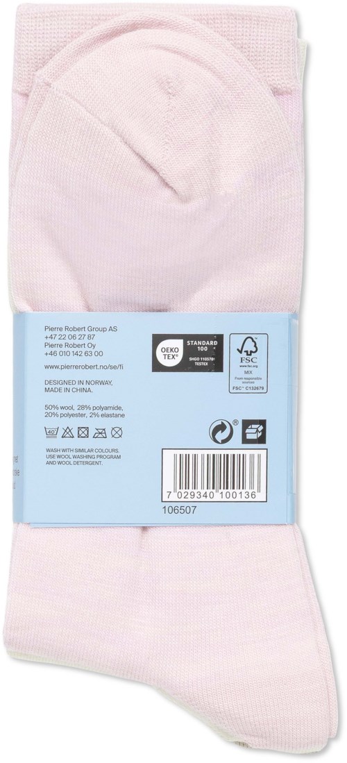 A pair of pink socks in packaging, with a label showing care instructions and bar code.