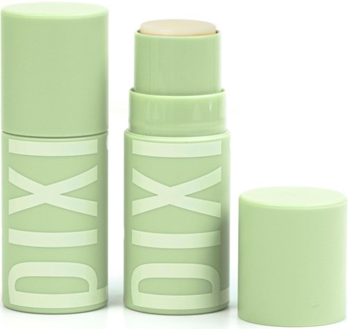 Twee groene houders, een met deksel, een deodorantstaaf, en een cilindrisch deksel, allemaal met 'DIXI' erop.