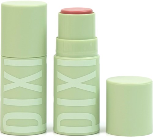 Drie groene cilindervormen containers met 'DIX' erop, eentje open met roze zalf erin.