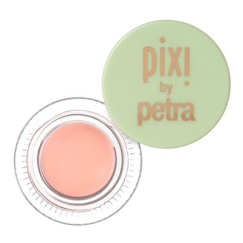 Een kleine pot met perzikkleurige crème of blush, met een groene deksel met de tekst 'PIX! by petra'.