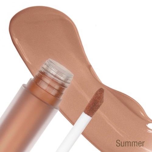 En beige flytende foundation med en svampapplikator på hvit bakgrunn.