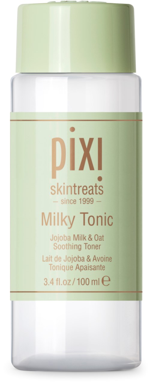 A tall clear bottle with a light green cap and label, containing Pixi Milky Tonic soothing toner.
