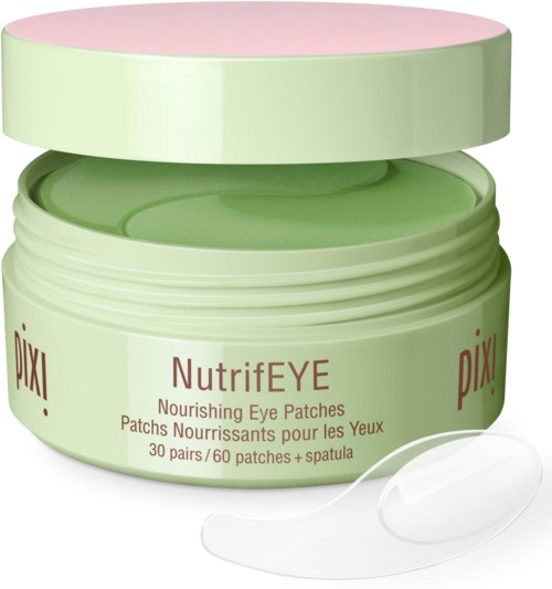A jar of Pixi NutrifiE nourishing eye patches, with some patches on the surface and an open lid. The jar is light green.