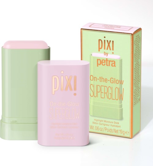 A light pink and green skincare product box and sticks with simple pastel colors and minimal text.