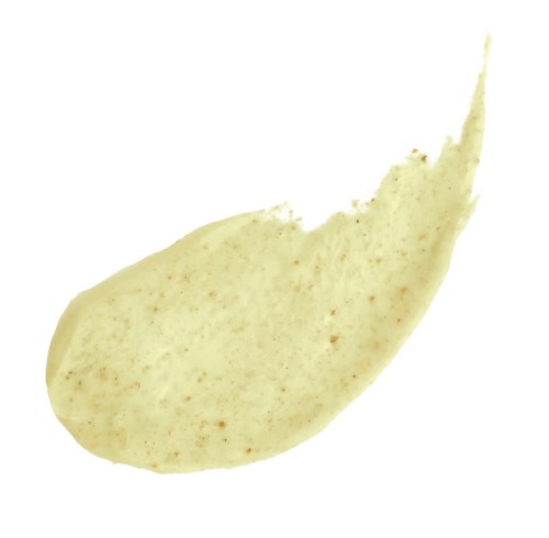 A dollop of light-colored sauce with specks, shaped with a pointed edge and a rounded base.