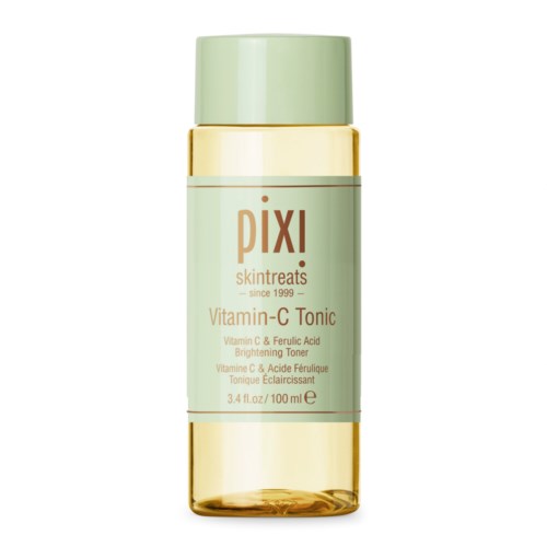 A light green and gold bottle of Pixi Vitamin-C Tonic for skincare, with text detailing product benefits.