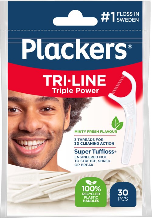 A pack of dental floss with a smiling person on it, labeled 'Plackers TRI-LINE', mentions triple power and mint flavor.