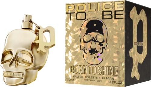 En guldfärgad spritflaska i form av ett skalle och en dojspåse med skalle- och polisbilder, märkt 'Born to Shine.'