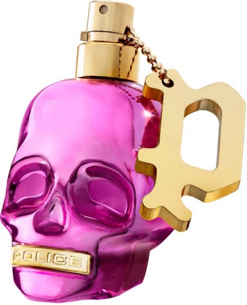 Een roze schedelvormig parfumflesje met een goudkapje en een sleutelhanger die eruitziet als een pistool.