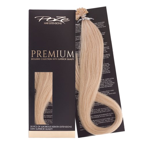 Blonde haarverlengingen op zwarte verpakking, gemarkeerd 'Premium' en '20 stuks luxe keratinextensies van topkwaliteit.'