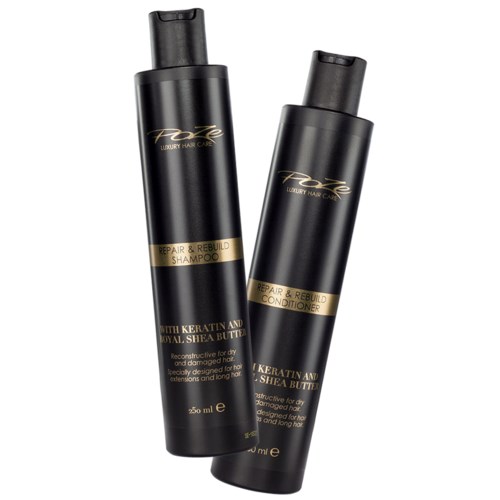 Two black bottles with gold labels, one shampoo and one conditioner, for hair repair and rebuilding, containing keratin and shea butter.