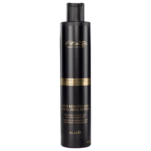 A black bottle with gold and white text, labeled as repair and rebuild shampoo for damaged hair.