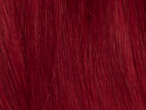 Close-up van rood haar met rechte plukken en glanzende uitstraling.