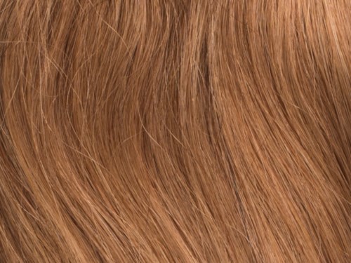Close-up van rood haar, met fijne haarstrengen en een glanzende textuur.