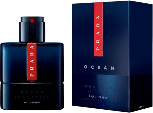 A dark blue perfume bottle with a red Prada logo and a matching box labeled Ocean Luna Rossa.