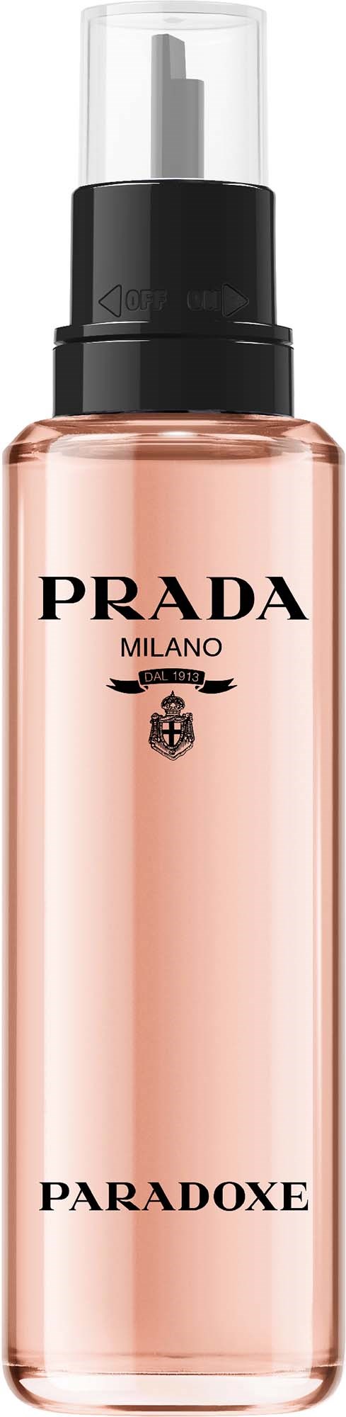 En rosa flaska med svart lock och pump, märkt Prada Milano Paradoxe parfym.