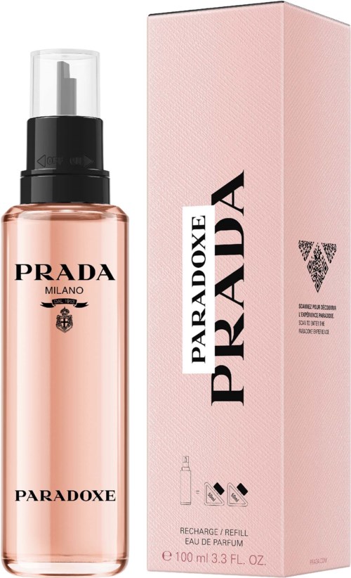 En rosa parfymflaska och matchande box med Prada-logga och text, märkt Paradoxe.