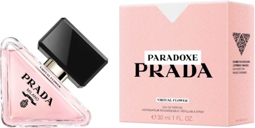 A pink Prada perfume bottle and box, with black and white labels, colorful text, and a glass bottle shape.
