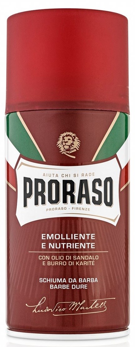 Punainen ja ruskea Proraso-spraypullo, valkoinen logo ja italiankielistä tekstiä, signeerauksella.