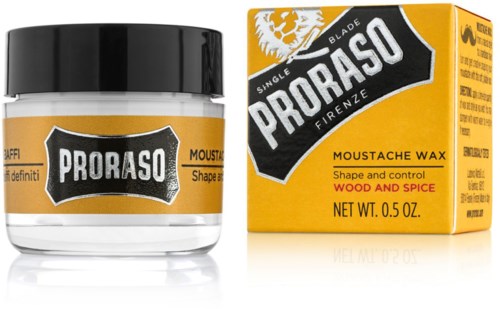 Pieni purkki Proraso-huultatuotteesta, jossa on puu ja mausteet, keltainen ja musta pakkaus.