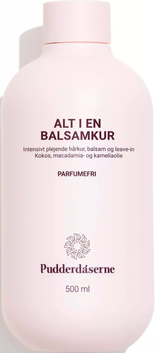 Rosa Flasche mit Text über Haarspülung, Kokos, Macadamia und Kamille, enthält 500 ml Haarpflegeprodukt.