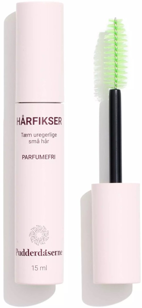 Eine kleine rosa Tube mit einer Bürste, die für Haarbehandlung verwendet wird, steht aufrecht mit geöffnetem Deckel.