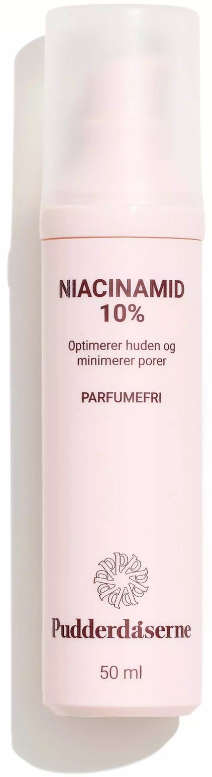 Eine weiße Flasche mit rosa Schrift, gekennzeichnet Niacinamide 10% für Hautpflege, 50 ml.