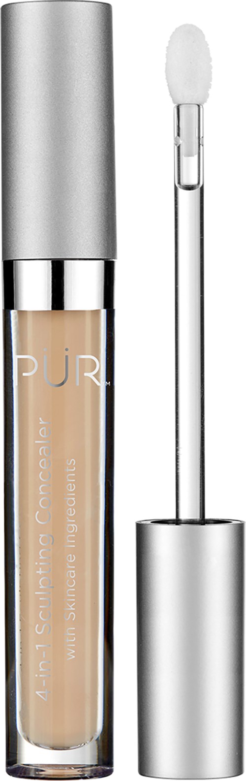 En beige flytande concealer i ett litet genomskinligt rör med silverfärgad topp och en vit applikatorborste.
