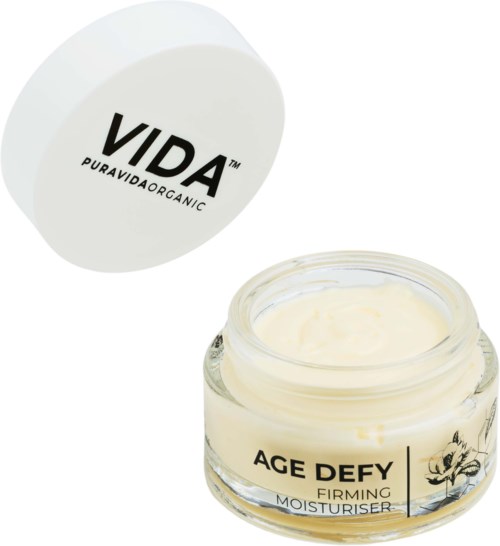 Een pot met 'AGE DEFY' en crème erin, deksel met 'VIDA' logo erboven.
