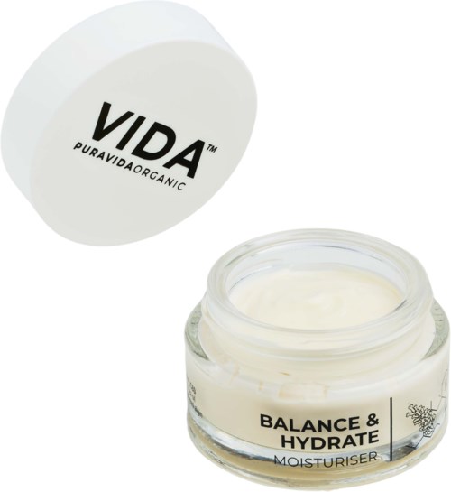 Open potje crème met 'Balance & Hydrate' label en witte deksel met 'VIDA PURAVIDA ORGANIC' logo.