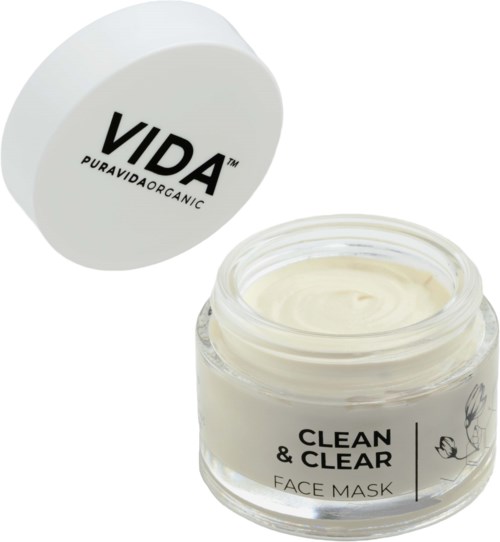 Een pot met romige gezichtsmasker met een deksel die zegt 'VIDA PURAVIDA ORGANIC' en een label 'CLEAN & CLEAR FACE MASK.'