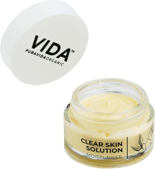 Een potje crème met deksel met 'VIDA' en een doorzichtige container met gele moisturizer.