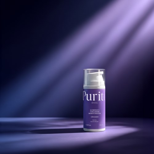 A purple and white bottle of moisturizer stands alone under spotlight on a dark surface.