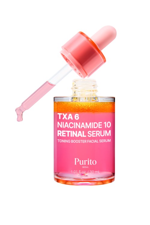En liten rosa flaska med dropper innehåller serum för huden, märkt med niacinamide och retinol för ansiktet.