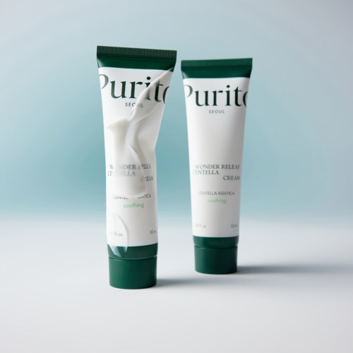 Twee tubes van Purito huidverzorgingsproduct staan rechtop op een eenvoudige achtergrond.