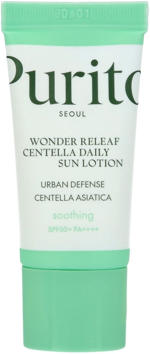 En grön och vit tub märkt Purito Wonder Releaf Sunscreen med SPF 50+ för skonsamt skydd av huden.