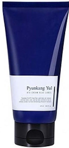 A blue tube with a white label, likely a skincare or cosmetic product, standing upright with a black cap.