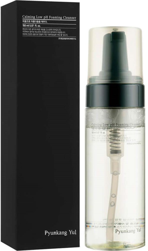 A bottle of calming low pH foaming cleanser with a black box. The bottle has a pump and transparent body.