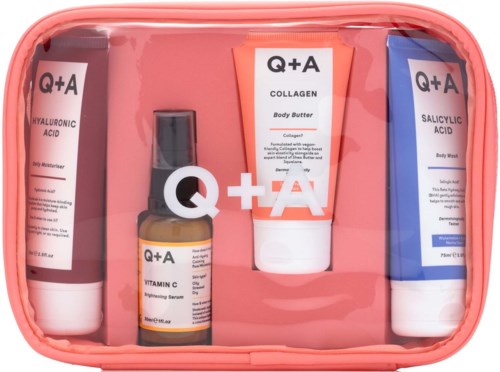 Q+A skincare set with vitamin C serum, collagen body butter, and salicylic acid body wash in a pink bag.