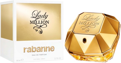 Lady Million Parfümflasche sieht aus wie ein goldener Edelstein. Die Box ist gold und weiß mit Markennamen.