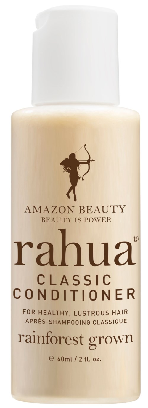 A beige bottle of Rahua Classic Conditioner with a white cap, labeled for healthy, lustrous hair, rainforest grown.
