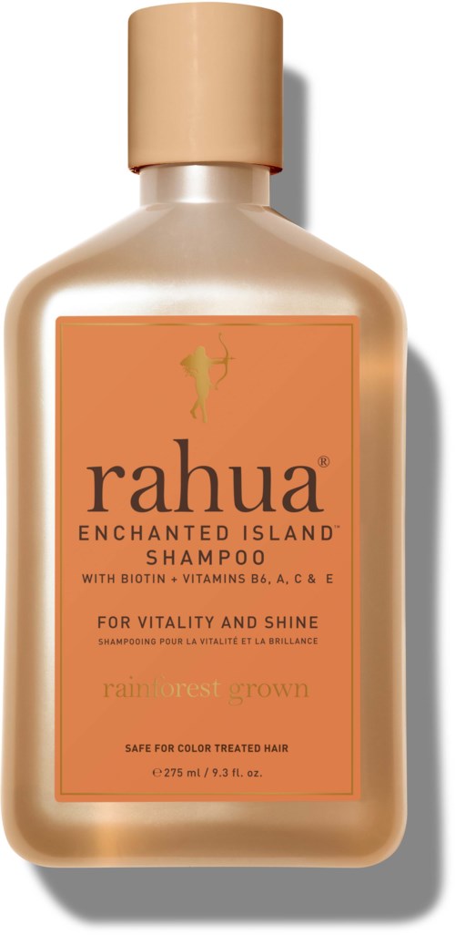 A shampoo bottle with a beige cap, orange label, and text about hair vitality and shine.